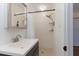 Renovated bathroom featuring tiled shower, modern vanity with a new mirror, and neutral decor at 1239 Wappetaw Pl, Mount Pleasant, SC 29464