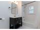 Updated bathroom features modern fixtures, a black vanity, and white subway tile at 1239 Wappetaw Pl, Mount Pleasant, SC 29464