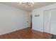 Open bedroom featuring hardwood floors, modern light fixture, closet and open door at 1239 Wappetaw Pl, Mount Pleasant, SC 29464