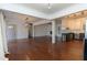 Open concept living space with hardwood floors and modern light fixture at 1239 Wappetaw Pl, Mount Pleasant, SC 29464