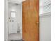 Bathroom showing a white vanity and toilet, with a view through an open door, showcasing practicality at 1442 N Sherwood Drive Dr, Charleston, SC 29407