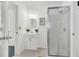 Clean bathroom with white vanity, framed mirror, and a glass-enclosed shower, offering a refreshing space at 1442 N Sherwood Drive Dr, Charleston, SC 29407