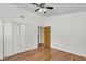 Bedroom view showcasing hardwood floors, neutral walls, a ceiling fan, and closet with bi-fold doors at 1442 N Sherwood Drive Dr, Charleston, SC 29407