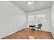 Bedroom view showcasing hardwood floors, neutral walls, a ceiling fan, and closet with bi-fold doors at 1442 N Sherwood Drive Dr, Charleston, SC 29407