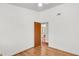 Bedroom view showcasing hardwood floors, neutral walls, and a doorway to another room at 1442 N Sherwood Drive Dr, Charleston, SC 29407