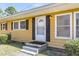 Close-up of front exterior with well-maintained lawn and black shutters at 1442 N Sherwood Drive Dr, Charleston, SC 29407