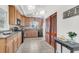 Spacious kitchen with tiled floors, wooden cabinetry, and modern appliances at 1442 N Sherwood Drive Dr, Charleston, SC 29407