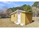 An backyard outbuilding offering practical storage with a sturdy door and convenient access at 1442 N Sherwood Drive Dr, Charleston, SC 29407