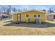The back of the house featuring a traditional central AC system and a secure door at 1442 N Sherwood Drive Dr, Charleston, SC 29407