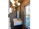 Modern powder room featuring a floating sink, wall mirror, and contemporary lighting at 1468 Alligator Creek Ct, Awendaw, SC 29429
