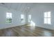 Spacious bedroom featuring vaulted ceilings, hardwood floors, and natural light at 1468 Alligator Creek Ct, Awendaw, SC 29429