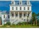 Bright, spacious two-story home with a welcoming front porch and coastal design at 1468 Alligator Creek Ct, Awendaw, SC 29429