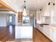 Spacious kitchen featuring a large island, custom cabinets, and modern appliances at 1468 Alligator Creek Ct, Awendaw, SC 29429
