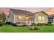 Rear house elevation at sunset with small garden and landscaping at 174 Sea Lavender Ln, Summerville, SC 29486