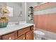 Bathroom featuring a wood vanity, white countertop, shower with curtain, toilet, and wall mirror at 174 Sea Lavender Ln, Summerville, SC 29486