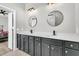 Modern bathroom with dual sinks, sleek black hardware, and ample storage space at 174 Sea Lavender Ln, Summerville, SC 29486