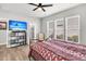 Well-lit bedroom featuring a mounted TV and a mix of natural light and neutral decor at 174 Sea Lavender Ln, Summerville, SC 29486
