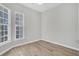 Serene bedroom with natural light, neutral walls, and sleek flooring for a modern aesthetic at 174 Sea Lavender Ln, Summerville, SC 29486