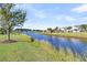 Scenic view of a tranquil waterway with charming homes lining the banks in a vibrant community at 174 Sea Lavender Ln, Summerville, SC 29486