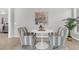 Cozy breakfast nook with a stylish table and chairs, complemented by a decorative piece of artwork at 174 Sea Lavender Ln, Summerville, SC 29486