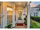 Welcoming front porch with seasonal decor, a door with glass inserts, and sunlit windows for added brightness at 174 Sea Lavender Ln, Summerville, SC 29486