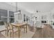 Open-concept living and dining area with abundant natural light and a cozy fireplace, perfect for Gathering gatherings at 174 Sea Lavender Ln, Summerville, SC 29486