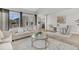 Open-concept living room with lots of natural light, flowing into dining area and kitchen at 174 Sea Lavender Ln, Summerville, SC 29486