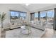 Bright living room with a view of the backyard, showcasing comfortable sofas and stylish decor at 174 Sea Lavender Ln, Summerville, SC 29486