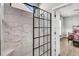 Luxurious walk-in shower with glass enclosure and stylish tile, adjacent to bedroom area at 174 Sea Lavender Ln, Summerville, SC 29486