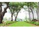 Gathering walking along a green path surrounded by lush trees and greenery at 1832 Nola Run, Summerville, SC 29485