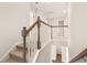 Upstairs hallway with hardwood floors, carpeted steps, and white trim at 1832 Nola Run, Summerville, SC 29485