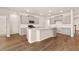 Modern kitchen featuring white countertops, gray cabinets, stainless steel appliances, and hardwood flooring at 1832 Nola Run, Summerville, SC 29485