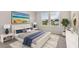 Comfortable bedroom featuring two windows, light gray walls, and a large bed with decorative pillows at 1844 Nola Run, Summerville, SC 29485