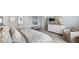 Bright and airy bedroom featuring a patterned duvet, neutral walls, and lots of natural light at 1844 Nola Run, Summerville, SC 29485