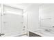 Bright bathroom featuring a shower-tub combo with modern fixtures and a large mirror at 201 Seele St, Lincolnville, SC 29485