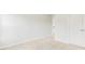 Neutral carpeted bedroom showing doorway and closet doors at 201 Seele St, Lincolnville, SC 29485