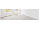 Bright bedroom showcasing a large window allowing natural light to illuminate the cozy carpeted floor at 201 Seele St, Lincolnville, SC 29485