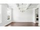 Dining room enhanced with a decorative chandelier and large windows at 201 Seele St, Lincolnville, SC 29485