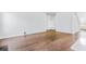 A spacious living room with beautiful hardwood floors and ample natural light at 201 Seele St, Lincolnville, SC 29485