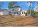 A two-story home with a spacious backyard covered in leaves at 2028 Wild Flower Lane, Charleston, SC 29414