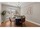 Elegant dining room with modern decor and a bay window offering natural light at 2028 Wild Flower Lane, Charleston, SC 29414