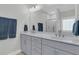 Bathroom featuring a large mirror over double sinks, with a view of a stylish, tiled shower at 207 Calm Water Way, Summerville, SC 29486