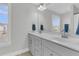 Bright bathroom with a double vanity, white countertop, and modern fixtures at 207 Calm Water Way, Summerville, SC 29486