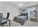 Well-lit bedroom with modern decor, a gray bed, and a display shelf at 207 Calm Water Way, Summerville, SC 29486