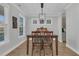 Inviting dining area featuring a chandelier and views through bright windows at 207 Calm Water Way, Summerville, SC 29486
