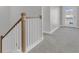 Hallway with neutral carpet, white trim, and a door leading to a balcony at 207 Calm Water Way, Summerville, SC 29486