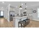 Well-lit kitchen featuring granite countertops, stainless steel appliances, and a breakfast bar with stools at 207 Calm Water Way, Summerville, SC 29486