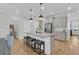 Bright kitchen with granite countertops, stainless steel appliances, island, and bar stool seating at 207 Calm Water Way, Summerville, SC 29486