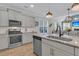 Open kitchen featuring granite counters, stainless appliances, island with sink, and pendant lighting at 207 Calm Water Way, Summerville, SC 29486