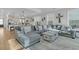 Bright living room with a large gray sectional, decorative pillows, and stylish coffee table at 207 Calm Water Way, Summerville, SC 29486